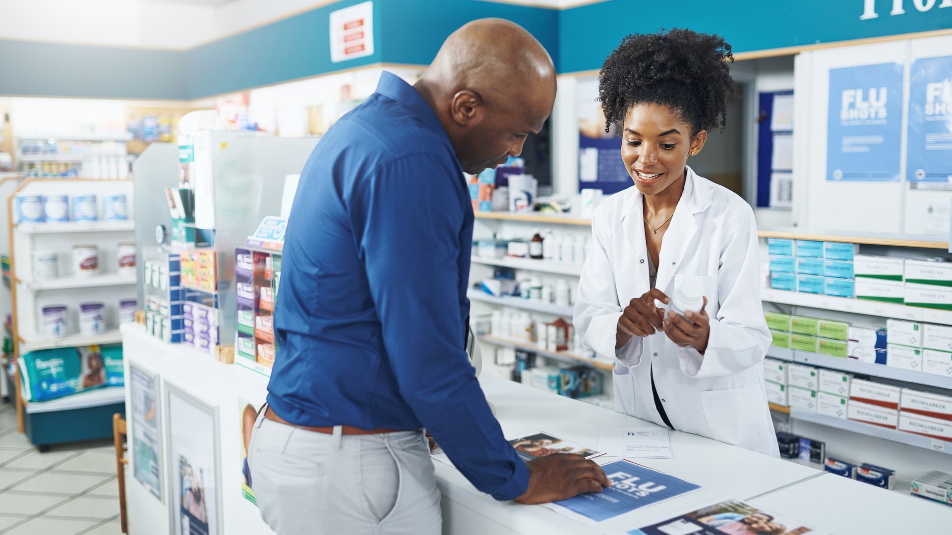 Pharmacist advising a customer