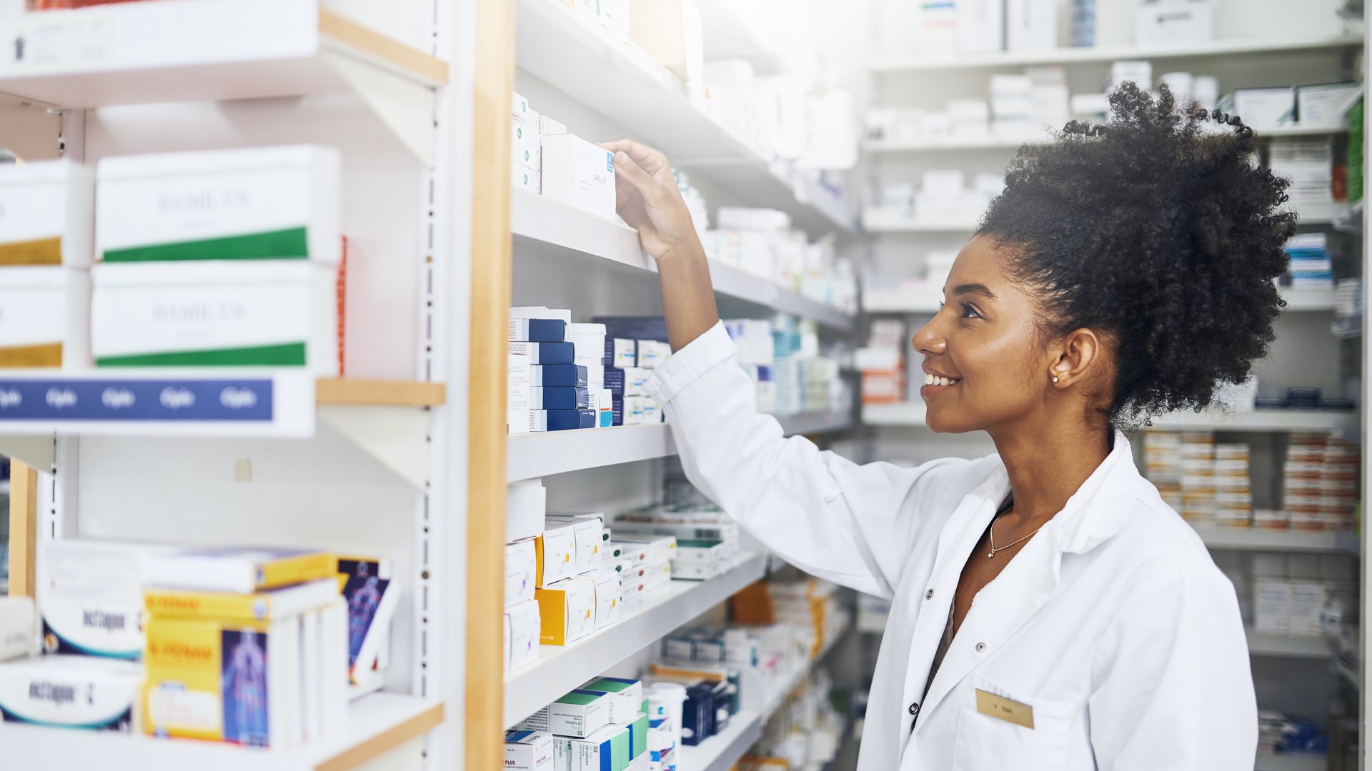 Pharmacist checking the medicine shelf